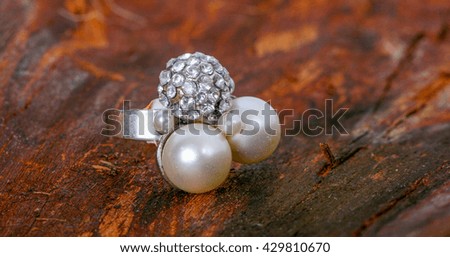 picture of a jewelry on wooden background
