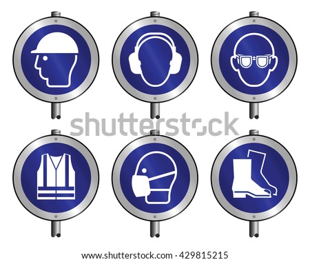 Mandatory construction manufacturing and engineering health and safety signs mounted on posts to current British Standards isolated on white background