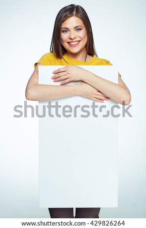 Big Sign bord. Smiling girl holding white banner. Isolated portrait.