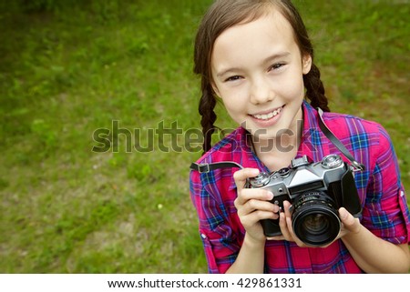 teenage girl with a camera. old photo camera. youth lifestyle