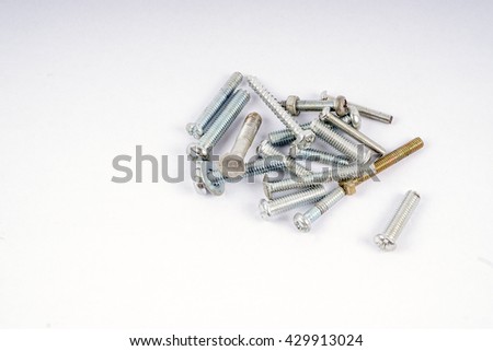 Group of screws isolated on white background. DOF and copy space.
