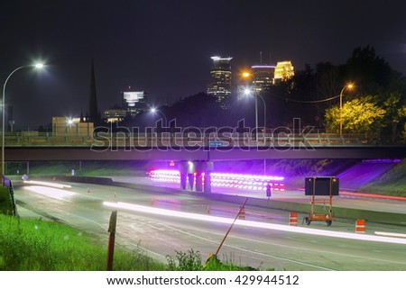 An Emergency Response Vehicle Makes a Purple Streak in this Long Exposure Highway and Cityscape Shot of Minneapolis