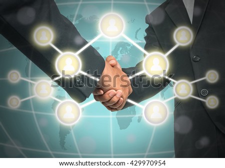 Business handshake with Social media symbol over the world map background, Elements of this image furnished by NASA, Business social network concept