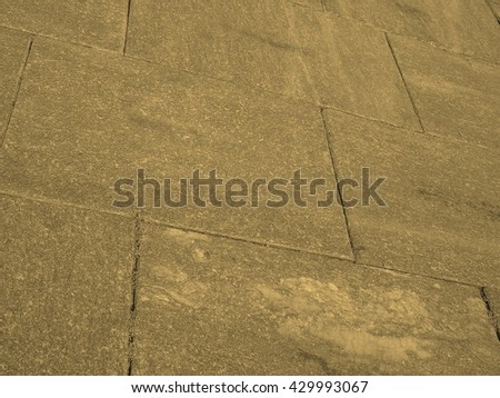 Stone floor texture useful as a background vintage sepia
