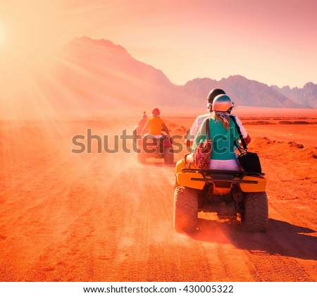 Motorcycle safari in the land Egypt. People travel. Beautiful  holiday background. Extreme hobby games.  Speed achievement tracking. Amazing desert Sharm. 