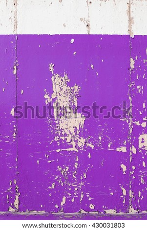 Purple dry peeling crackling chipped paint textured wall