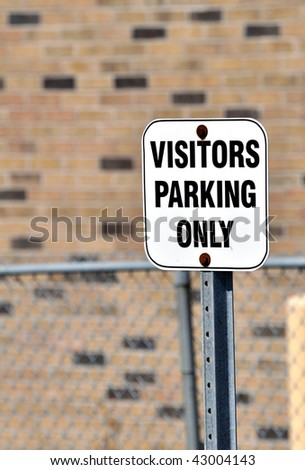 Visitors parking sign.