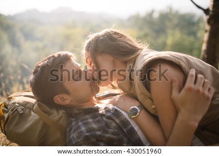 happy woman passionately kisses her boyfriend