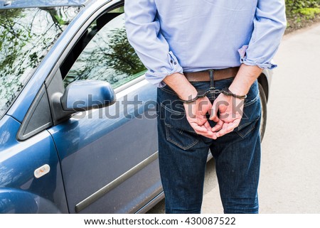 Photo of man in handcuffs. Royalty-Free Stock Photo #430087522