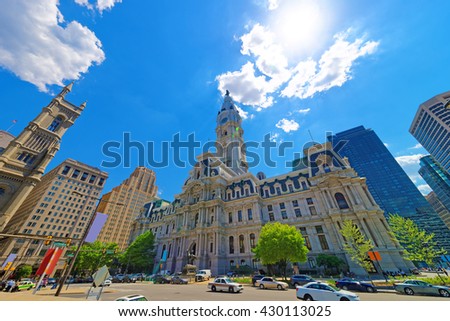 Philadelphia City Hall with William Penn figure on Tower. View from the street. Tourists in the street. Pennsylvania, USA