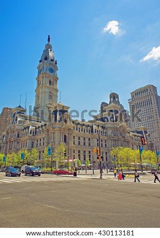 Philadelphia City Hall with William Penn figure on the Tower. View from the street. Tourists in the street. Pennsylvania, USA