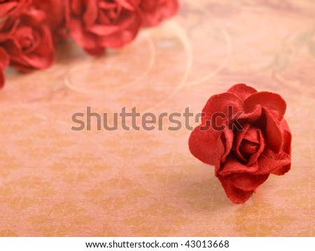 closeup shot of red paper flowers on light background