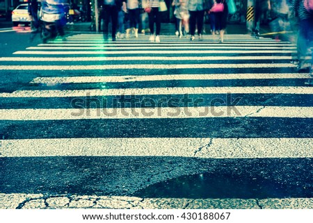 Artistic style - Vintage style, Crosswalk and pedestrian at modern city zebra crossing street in rainy day. Blur abstract.Background concept.