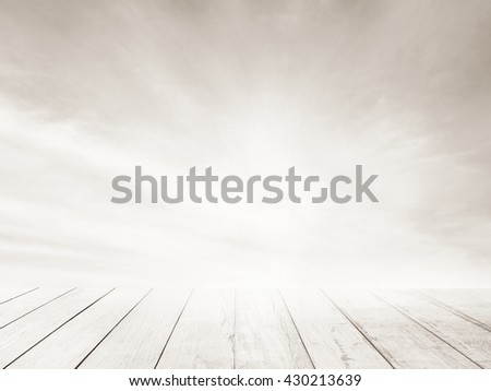 Soft focus clouds sky background white old wood floor. Blur blue sky white sunlight day time gray tone background. Abstract blurred on vacation summer ocean beach. Wooden stage for watching nature.
