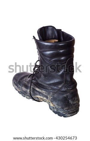 One dirty old boot on his right foot. Army boots. Isolated on white background.