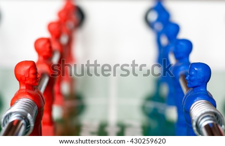 Two opposite teams, red team and blue team, in a table football Royalty-Free Stock Photo #430259620
