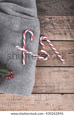 Christmas composition with candy canes and a plaid