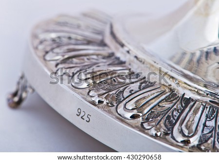 Close up photo of handmade silverware that is delicately handcrafted, silver handicrafts, Custom made authentic designs are the key factor in getting the fine art made. Decorative silver vase Royalty-Free Stock Photo #430290658
