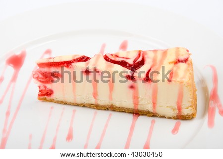 Cheesecake at plate on a white background