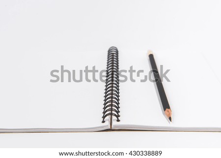 Blank Notebook with Pencil isolated on White Background.