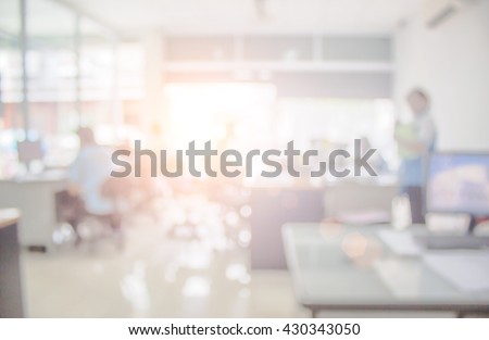 Businessmen blur in the workplace or work space of table work in office with computer or shallow depth of focus of abstract background.