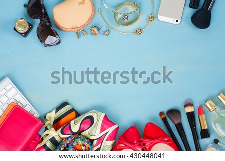 styled feminine desktop - woman fashion items on blue wooden background