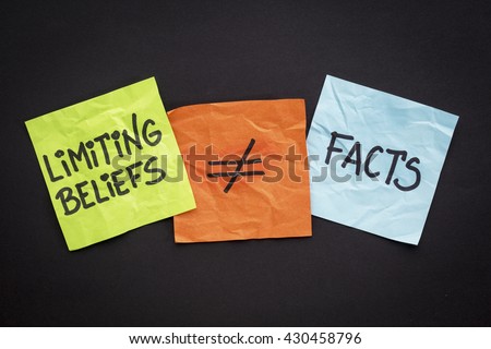 limiting beliefs are not facts concept - handwriting on sticky notes against black paper background Royalty-Free Stock Photo #430458796