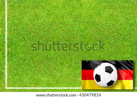 Soccer field with german flag and soccer ball
