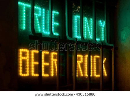 "True beer only rock" neon sign