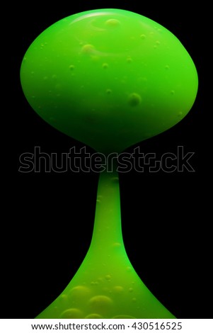 Green fluid on a black background