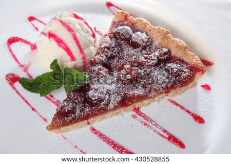 Berry pie with ice cream and mint