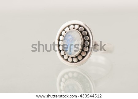 Isolated silver ring with opal stone on white background