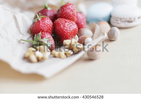 Shabby strawberry. Strawberry and nuts. Strawberry, nuts and macaroons. Sweet healthy morning. Rustic background. 