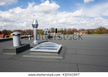 inox Chimney on the flat roof in the city Royalty-Free Stock Photo #430561897
