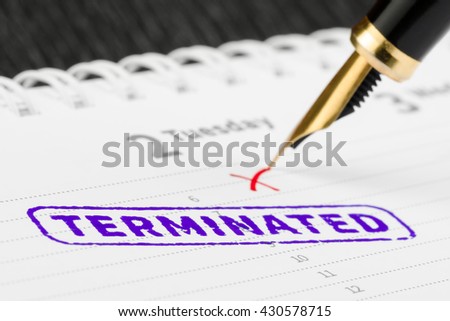 Macro shot of terminated stamp and fountain pen on a scheduler. Royalty-Free Stock Photo #430578715