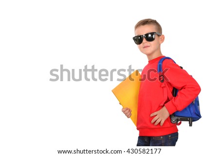 Little boy on a white background. Looking at camera. School concept