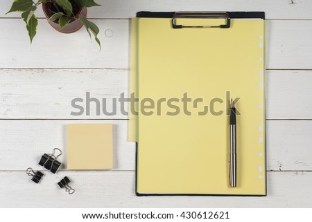 Business blank, notepad and pen at office desk table top view. Corporate stationery branding mock-up.  Copy space for text.