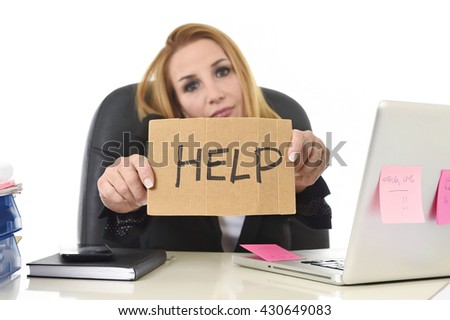 frustrated attractive businesswoman in her 40s holding help sign desparate suffering stress overworked and overwhelmed working at office laptop computer in sad and worried face expression