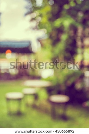 image of Abstract blurred outdoor coffee hut on day time , in garden for background usage . (vintage tone)