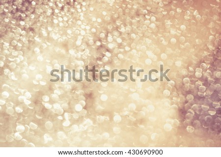Defocused bokeh. Abstract background white bokeh lights different circles for Christmas and happy new year holiday background. Vintage picture style.
