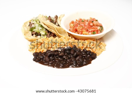 Steak soft tacos with Mexican rice, black beans, and fresh salsa.