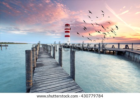 lighthouse at Lake Neusiedl at sunset near Podersdorf, Burgenland, Austria                                Royalty-Free Stock Photo #430779784
