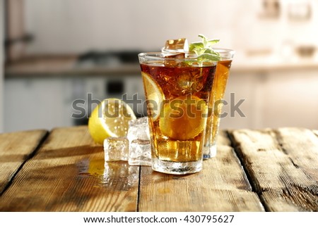 wooden table of cold drinks and mint 