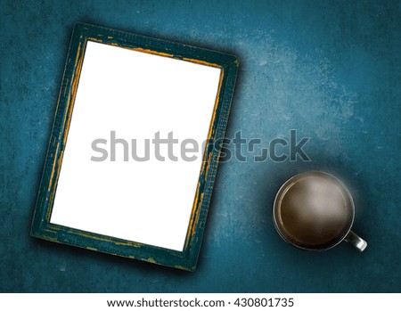 cup of coffee with smoke put on old wooden and blank picture frame for insert your text.
