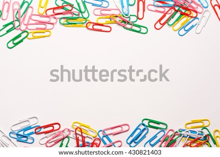 Colorful paperclips on white background. Isolated paperclip. Office supplies. Stationery supplies.