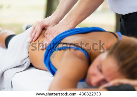 Sports massage, focus on hands Royalty-Free Stock Photo #430822933