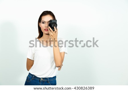young asian woman taking picture with slr vintage camera isolated white background.