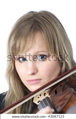 Portrait of beautiful young female violinist playing violin over white background