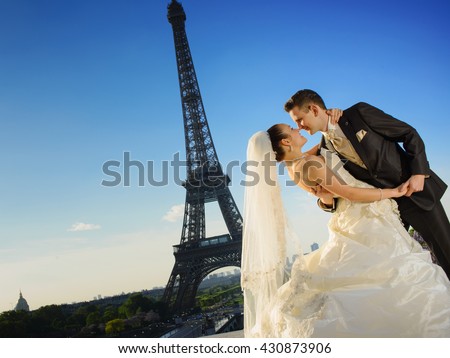 Loving couple in front of Eiffel Tower background, Paris, France
