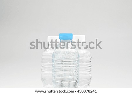 rows of water bottles isolate on white background